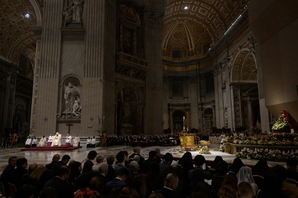 Pope Francis presides the Easter vigil as part of the Holy Week celebrations, at St Peter’s Basilica in the Vatican on March 30, 2024. — AFP pic