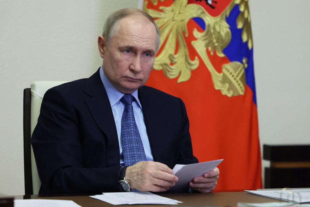 File photo of Russian President Vladimir Putin chairing a meeting on the Five Seas and Lake Baikal project of federal all-year-round resorts, via video link at the Novo-Ogaryovo state residence outside Moscow, Russia March 28, 2024. — Reuters pic