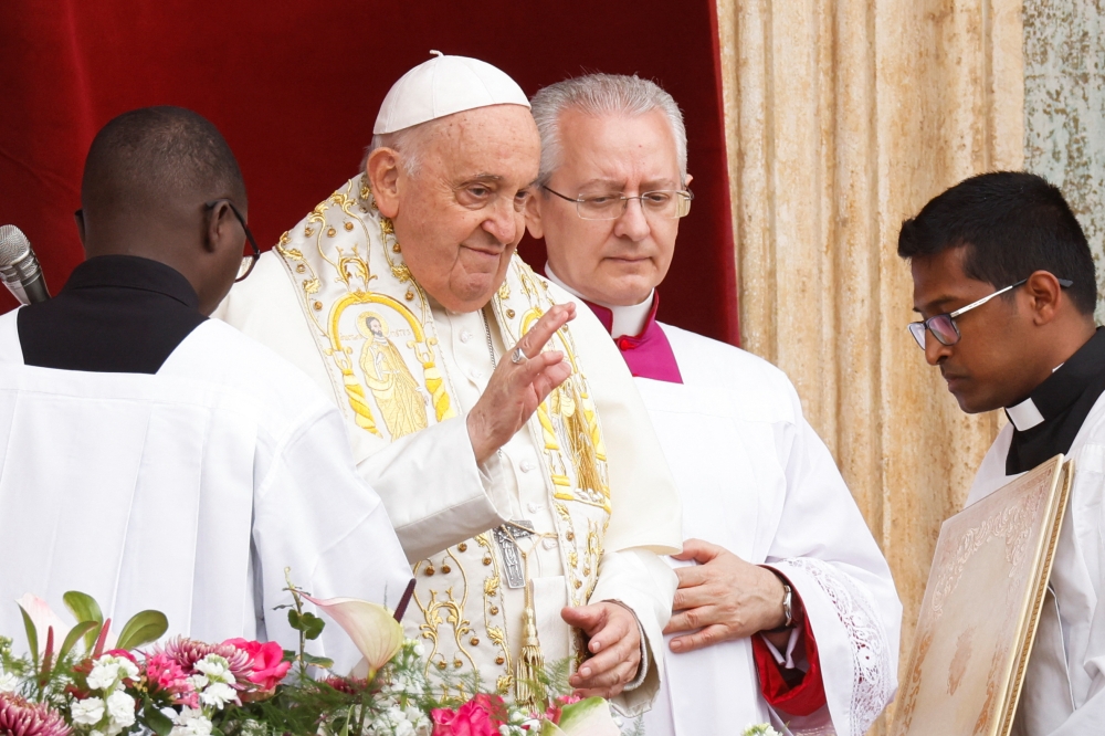 The pontiff presided over Mass in a packed and flower-bedecked St Peter’s Square, and then delivered his “Urbi et Orbi” (to the city and the world) blessing and message from the central balcony of St. Peter’s Basilica. — Reuters pic