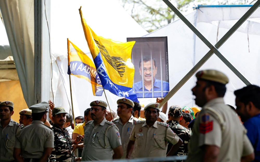 Police officers stand guard during a protest rally against the arrest of Aam Aadmi Party's main leader and Delhi Chief Minister Arvind Kejriwal, at the Ramlila Ground in New Delhi, India March 31, 2024. — Reuters pic