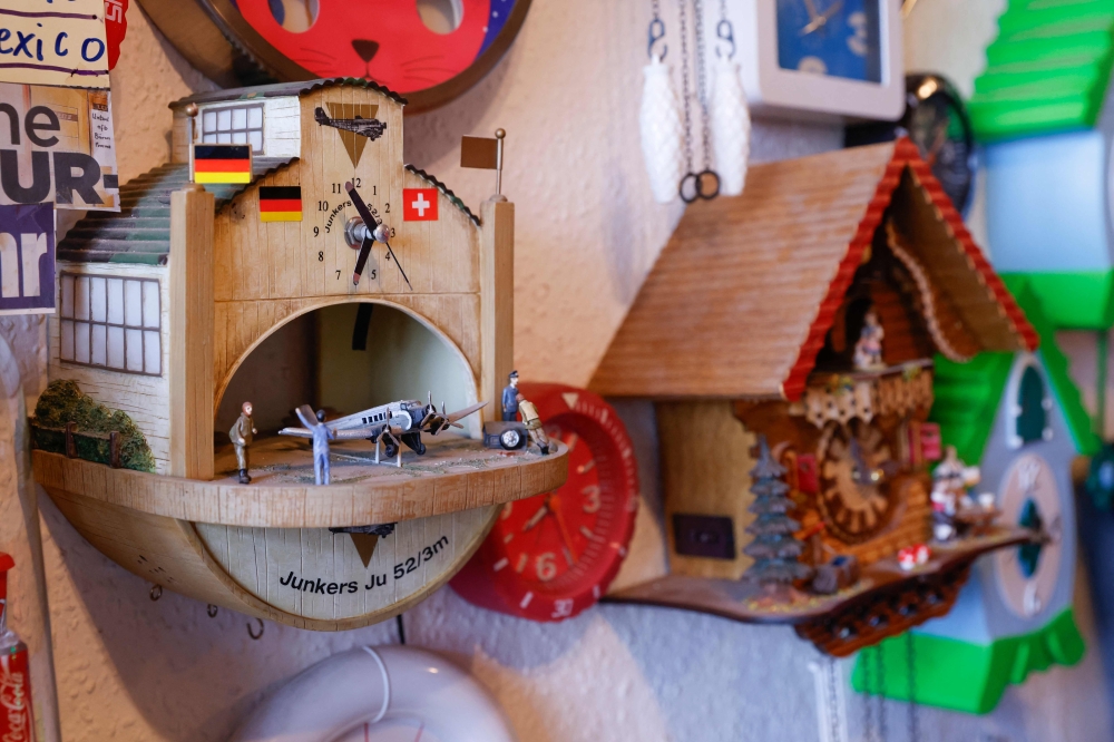 Clocks as part of the collection of Werner Stechbarth are pictured in his living room in Munich March 22, 2024. — AFP pic