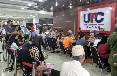 Crowds throng Kota Kinabalu Urban Transformation Centre counters to beat deadline for Padu registration