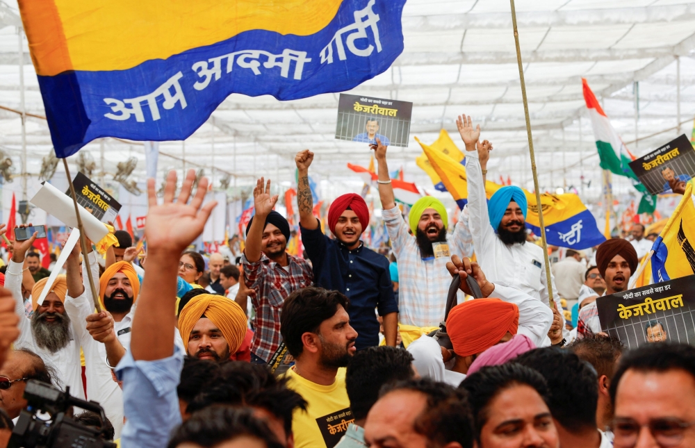 Supporters of Aam Aadmi Party’s attend a protest rally against the arrest of Aam Aadmi Party’s main leader and Delhi Chief Minister Arvind Kejriwal in New Delhi yesterday. — Reuters pic