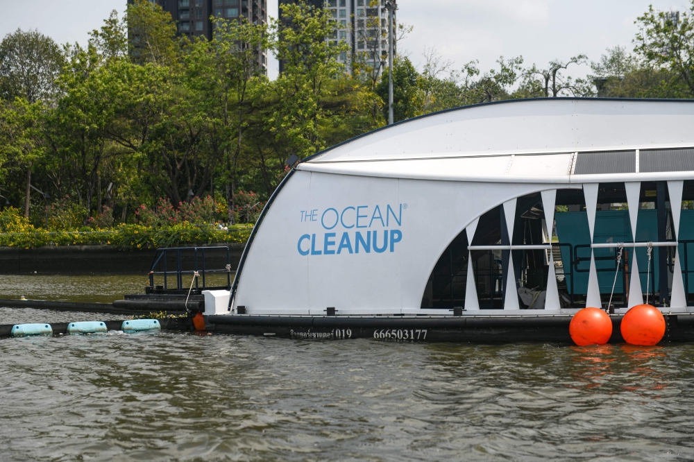 The Ocean Cleanup's Interceptor which captures floating plastic and trash before it reaches the ocean is seen during a press visit on the Chao Phraya river in Bangkok on March 26, 2024. — AFP pic