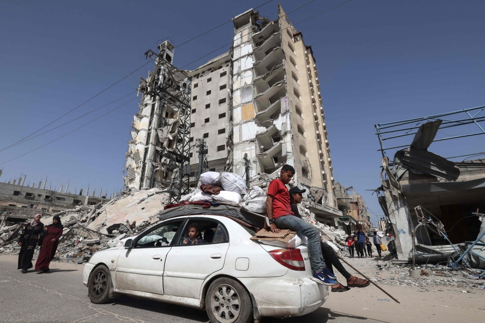 Members of a Palestinian family leave Rafah in the southern Gaza Strip with personal belongings on March 31, 2024, amid the ongoing conflict between Israel and the militant group Hamas. — AFP pic