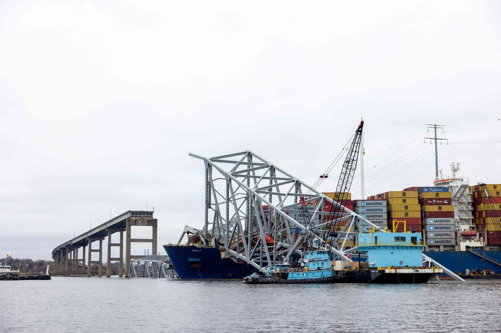 Wreckage from the collapsed Francis Scott Key Bridge rests on the cargo ship Dali efforts begin to clear the debris and reopen the Port of Baltimore on April 1, 2024 in Baltimore, Maryland. — AFP pic