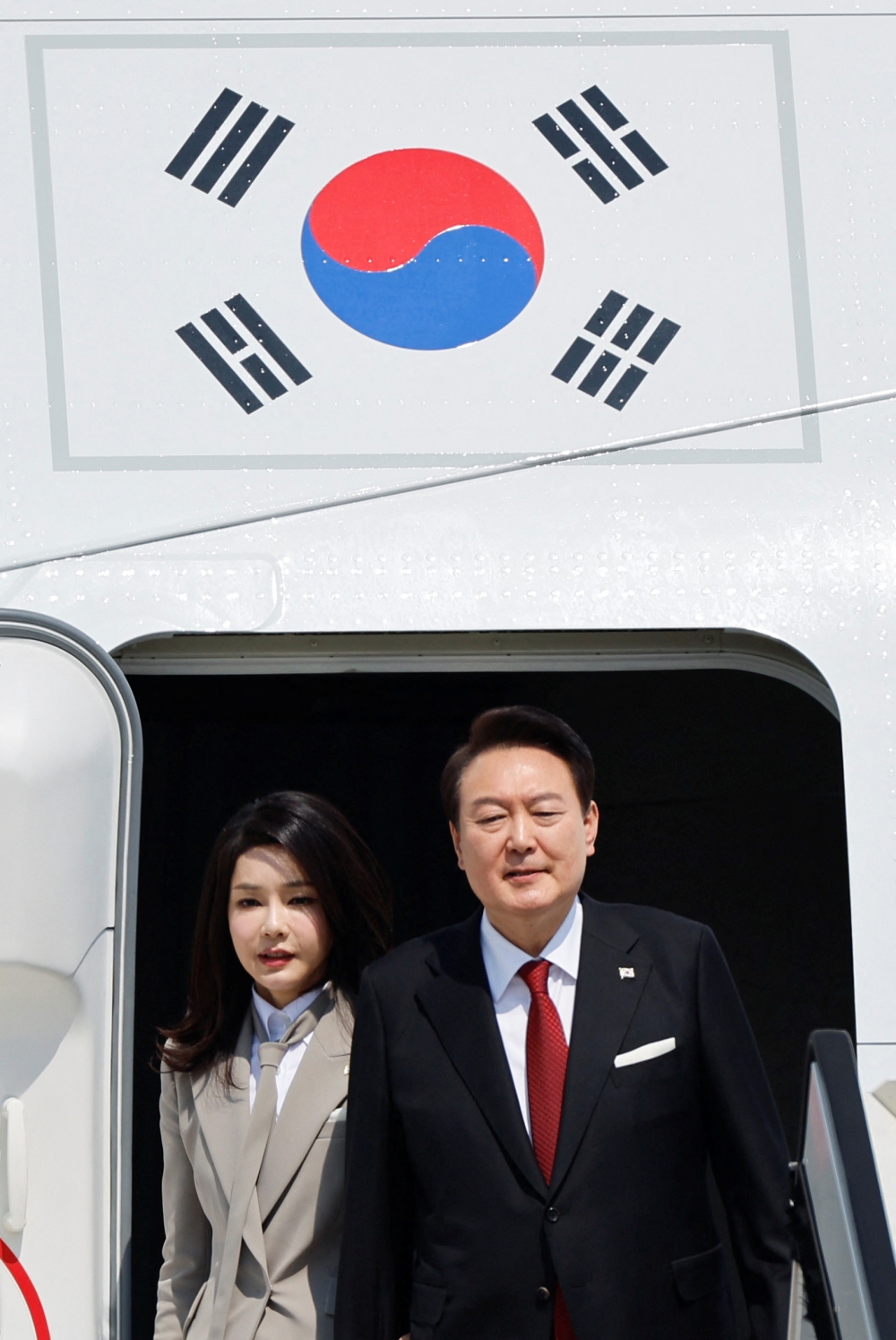 South Korea's President Yoon Suk-yeol and his wife Kim Keon-hee arrive at Tokyo International Airport (Haneda Airport) on March 16, 2023. Kim has been a drag on Yoon’s popularity, which dipped to 36.3 per cent in a survey of 2,509 people published on Monday by pollster Realmeter, from a recent high of 41.9 per cent. — Reuters pic