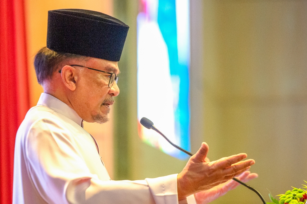 Prime Minister Datuk Seri Anwar Ibrahim, who is also finance minister, delivers his speech during the Finance Ministry's monthly assembly in Putrajaya April 2, 2024. — Picture by Shafwan Zaidon