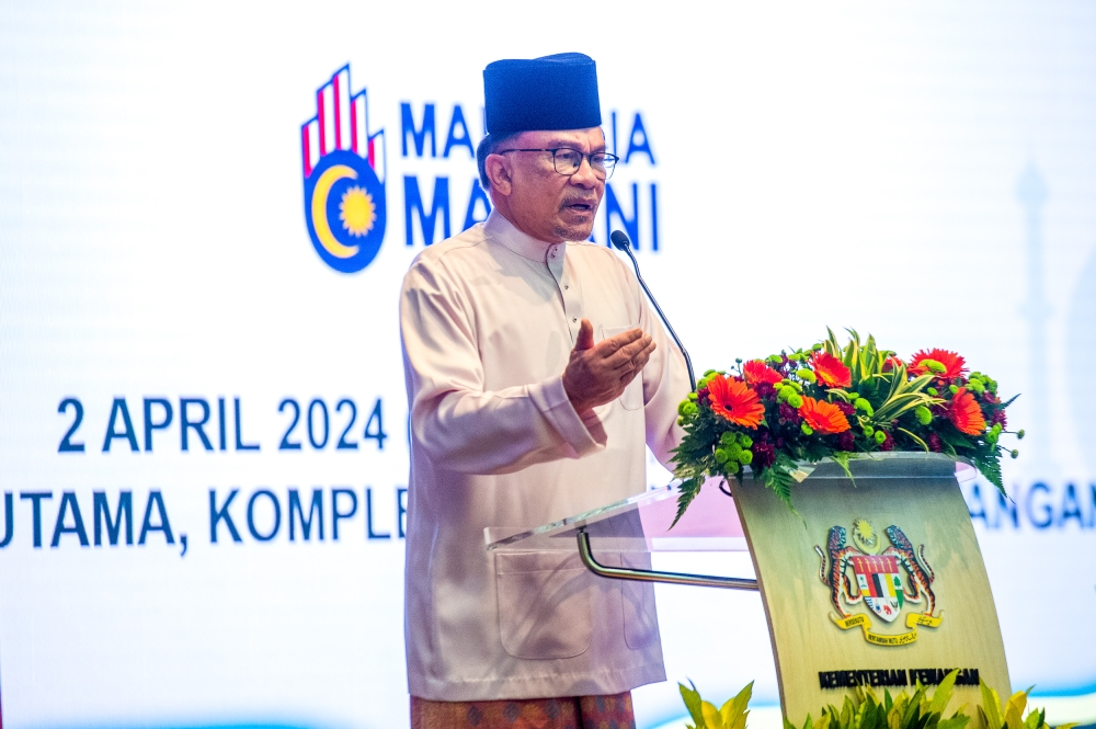 Datuk Seri Anwar Ibrahim said that the implementation of targeted subsidies and changes to the pension system should not be questioned, as done by a certain Member of Parliament (MP) claiming that some MPs are also classified as B40. — Picture by Shafwan Zaidon