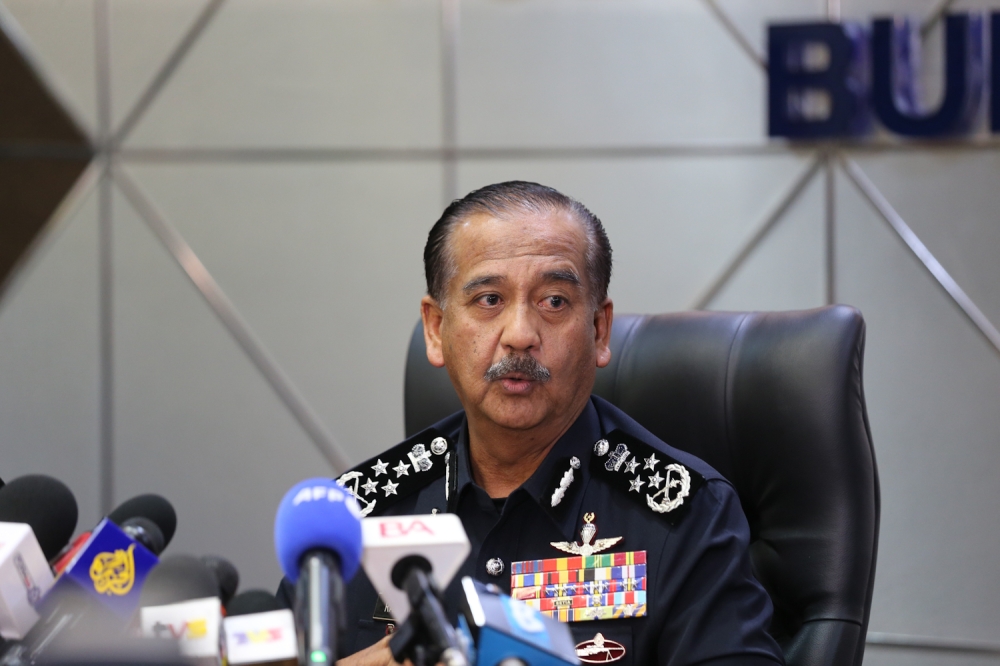 Inspector-General of Police Tan Sri Razarudin Husain said the number of firearms found on the man was unusual even with the latter’s professed aim of assassinating a compatriot in Malaysia. —  Picture by Raymond Manuel