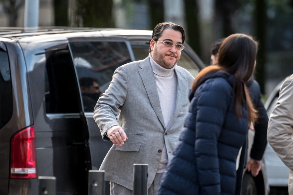 PetroSaudi executive Tarek Obaid (left) arrives at the Swiss Federal Criminal Court for the opening day of his trial for the alleged embezzlement and laundering of the Malaysian sovereign wealth fund 1MDB, in Bellinzona, on April 2, 2024. — AFP pic