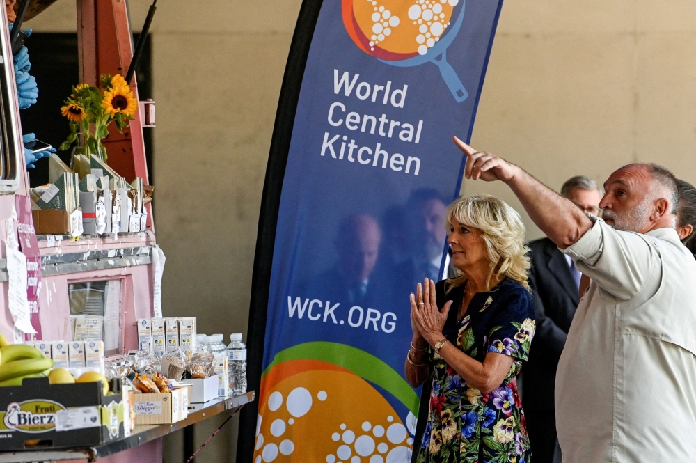US first lady Jill Biden and Spanish chef Jose Andres greet volunteers of the World Central Kitchen association, during her visit with Spain's Queen Letizia to a reception centre for Ukrainian refugees in Pozuelo de Alarcon, on the sidelines of Nato summit, near Madrid, Spain, June 28, 2022. — Oscar del Pozo/Pool via Reuters pic