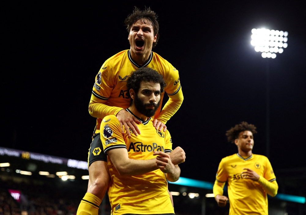 Wolverhampton Wanderers' Rayan Ait-Nouri celebrates with Hugo Bueno after scoring the first goal against Burnley April 3, 2024. ― Reuters pic