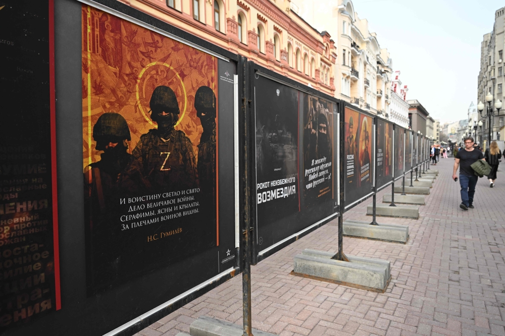 A street exhibition of military-themed posters as seen in Moscow on April 2, 2024. The spring conscription campaign, running from April 1 to July 15, will call up 150,000 men from the age of 18 to 30 for compulsory year-long military service. — AFP pic