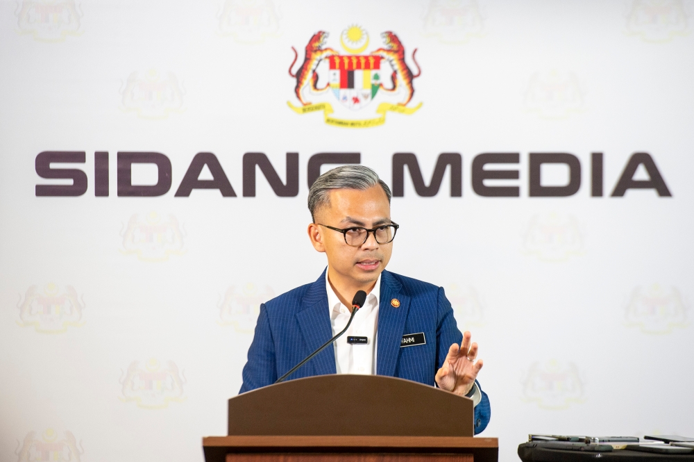 Communications Minister Fahmi Fadzil speaks during a post-Cabinet meeting press conference in Putrajaya on April 3, 2024. — Picture by Shafwan Zaidon
