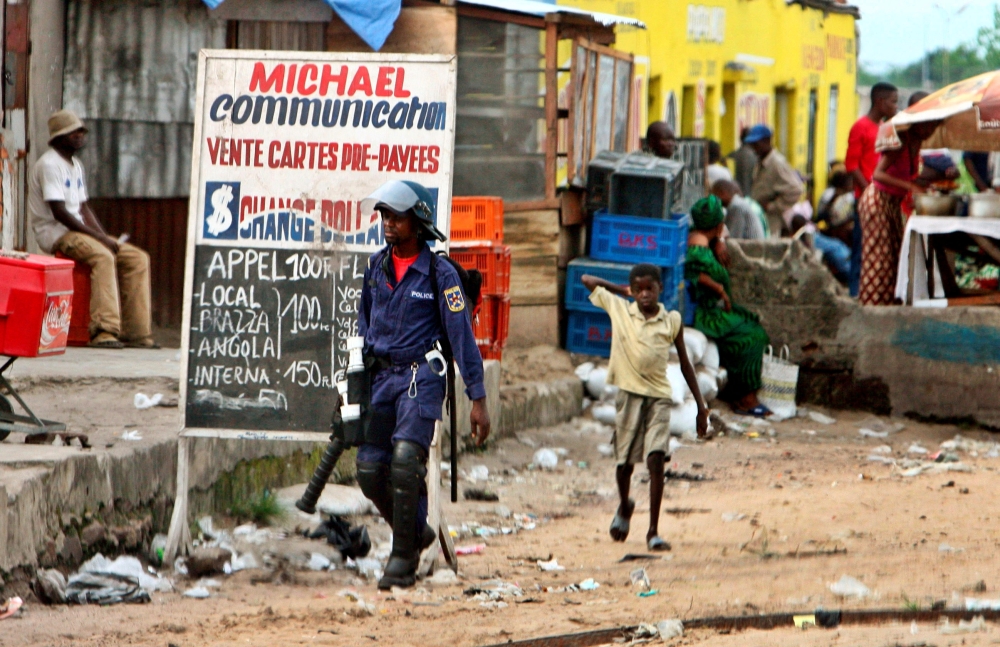 Congolese riot policeman walks near a jail in Kinshasa October 26, 2006. –– Reuters pic