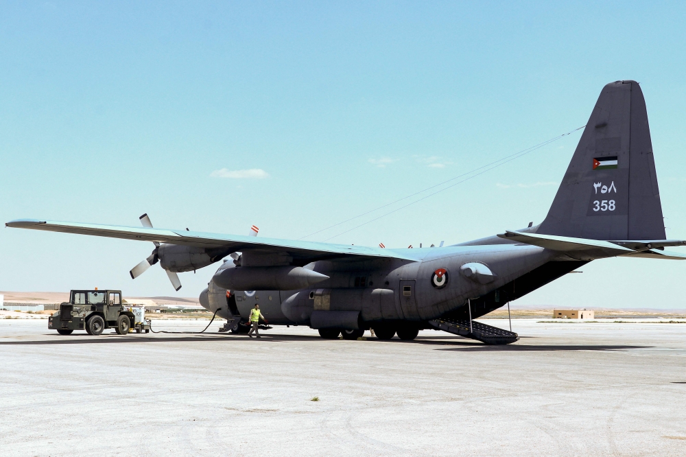 This handout picture released by the Jordanian army on April 3, 2024, shows a C-130 Hercules military transport aircraft of the Royal Jordanian Air Force at an airfield as part of the missions dropping humanitarian aid over the Gaza Strip, amid ongoing battles between Israel and the Palestinian militant group Hamas. –– Jordanian Army via AFP pic
