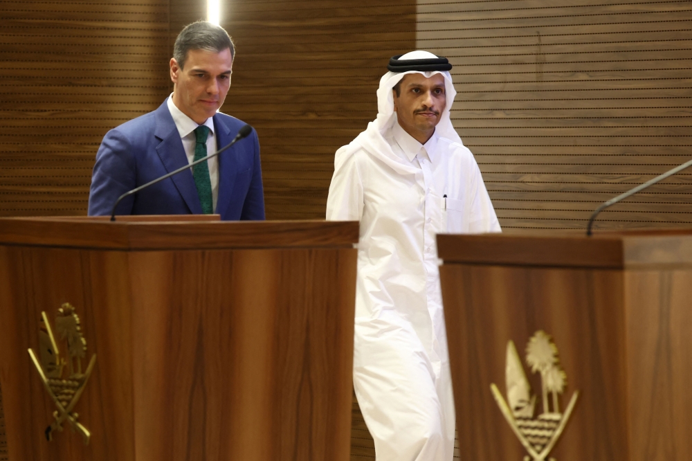 Spanish Prime Minister Pedro Sanchez and his Qatari counterpart Sheikh Mohammed bin Abdulrahman bin Jassim al-Thani leave the podium after giving a joint press conference in Doha on April 3, 2024. — AFP pic