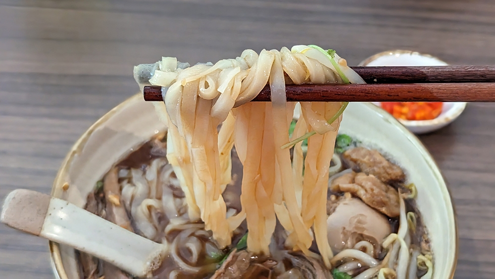 The Braised Duck Flat White Noodles feature 'kuey teow' for noodles.