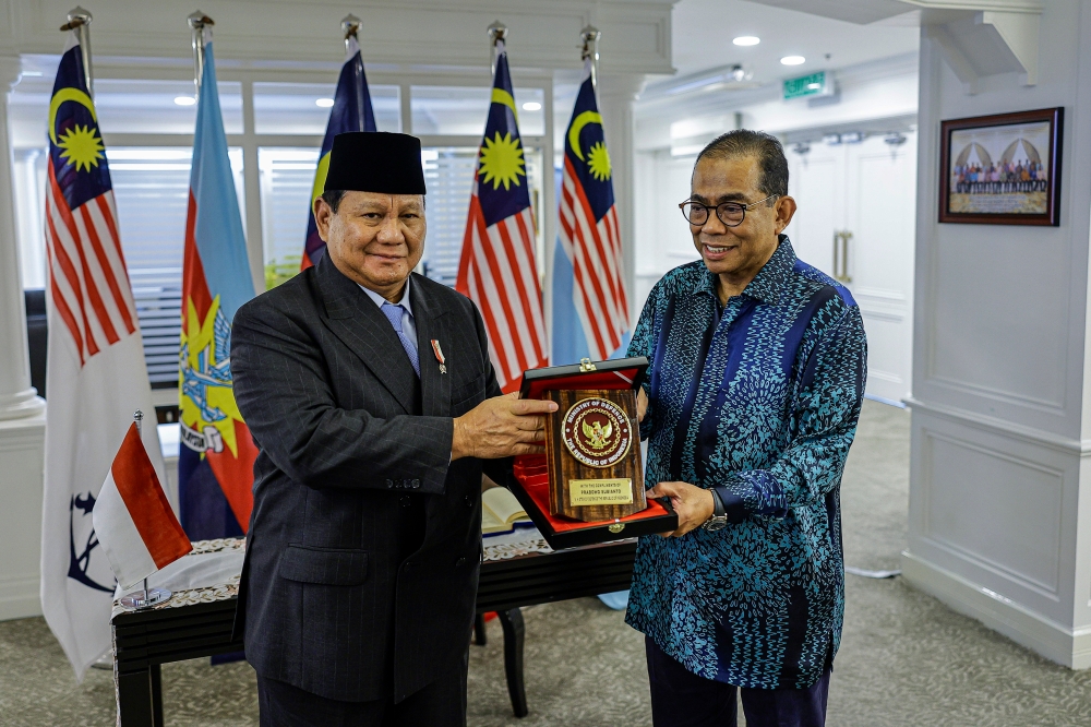Indonesia’s President-Elect and Defence Minister Prabowo Subianto (left) presents a souvenir to Defence Minister Datuk Seri Mohamed Khaled Nordin during a courtesy call at Wisma Pertahanan in Kuala Lumpur April 4, 2024. — Bernama pic