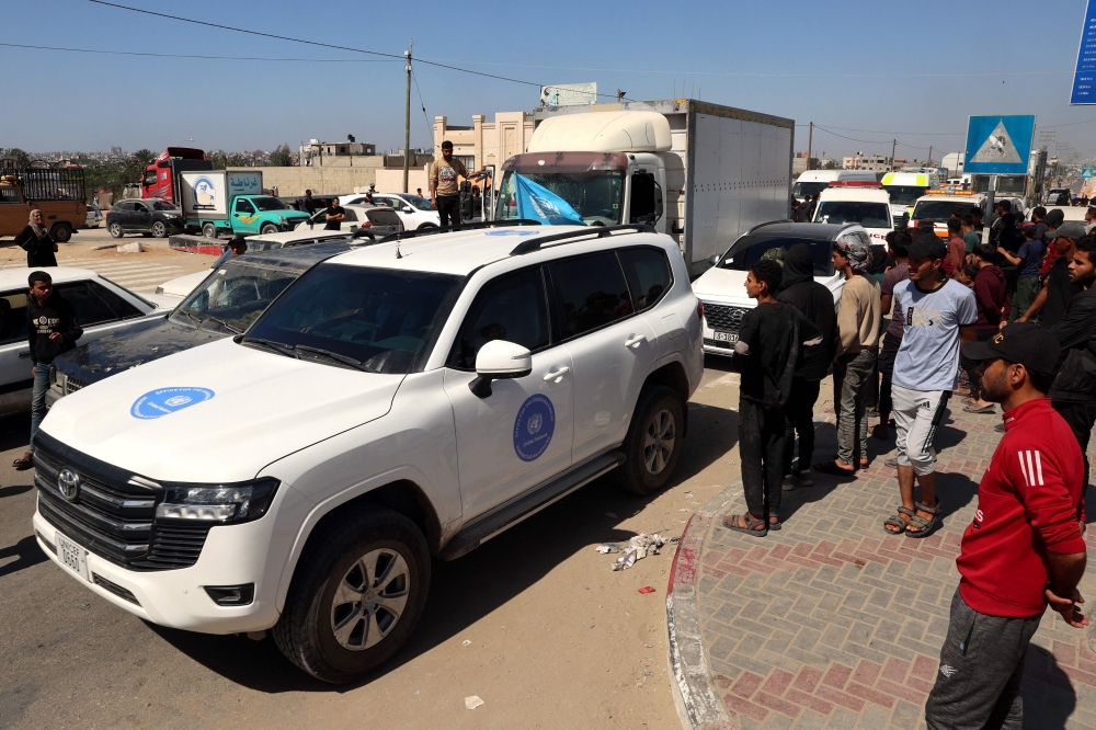 The convoy carrying the bodies of staff members of the US-based aid group World Central Kitchen, arrives at the Rafah crossing with Egypt in the southern Gaza Strip on April 3, 2024, two days after a convoy of the NGO was hit in an Israeli strike as battles continue between Israel and the Palestinian group Hamas. The bodies of six foreign aid workers killed in a Gaza strike were expected to be transported out of the war-torn Palestinian territory on April 3, as Israel faced a chorus of outrage over their deaths. — AFP pic
