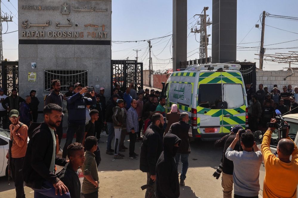 One of the ambulances carrying the bodies of staff members of the US-based aid group World Central Kitchen, arrive at the Rafah crossing with Egypt in the southern Gaza Strip on April 3, 2024, two days after a convoy of the NGO was hit in an Israeli strike as battles continue between Israel and the Palestinian militant group Hamas. — AFP pic