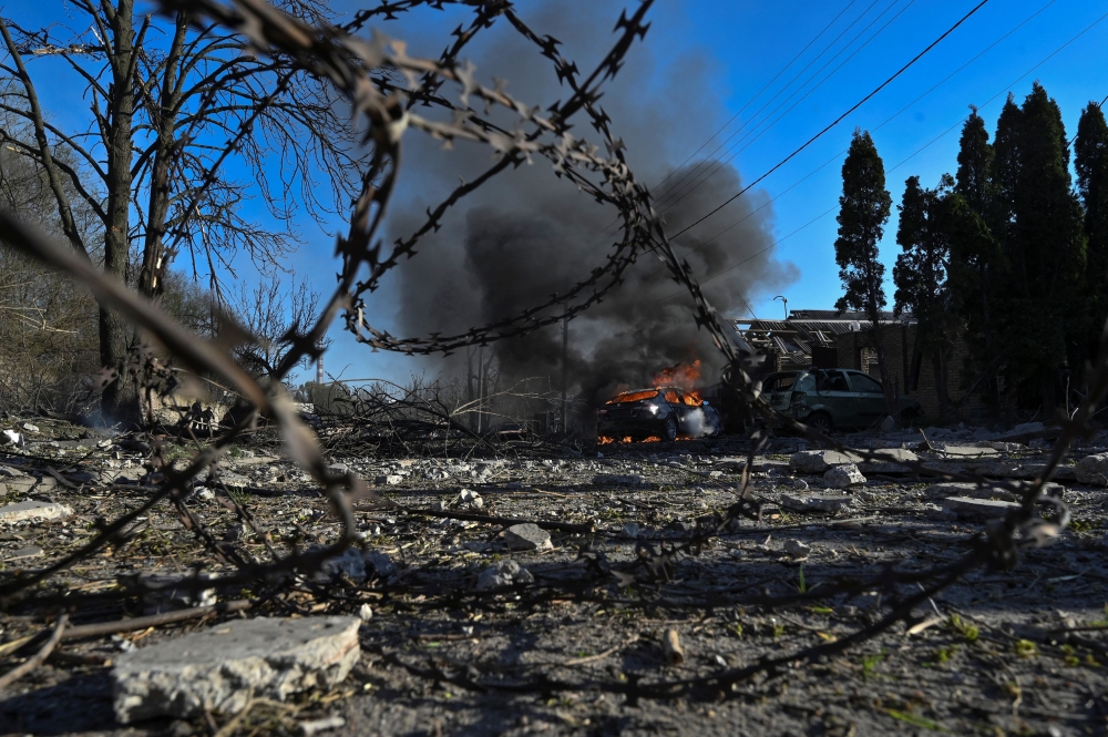 A car burns at a site of a Russian missile strike, amid Russia's attack on Ukraine, in Zaporizhzhia Ukraine April 5, 2024. ― Reuters pic