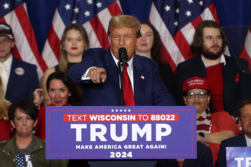 Former US President and 2024 presidential hopeful Donald Trump speaks during a campaign rally at the Hyatt Regency in Green Bay, Wisconsin April 2, 2024. — AFP pic