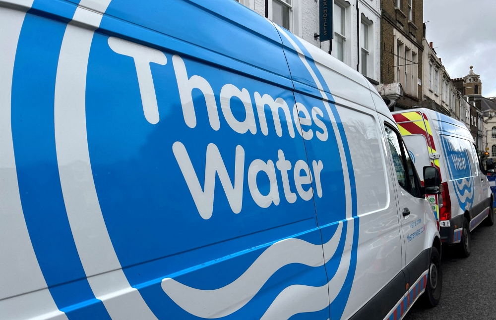 Thames Water vans are parked on a road as repair and maintenance work takes place, in London April 3, 2024. — AFP pic