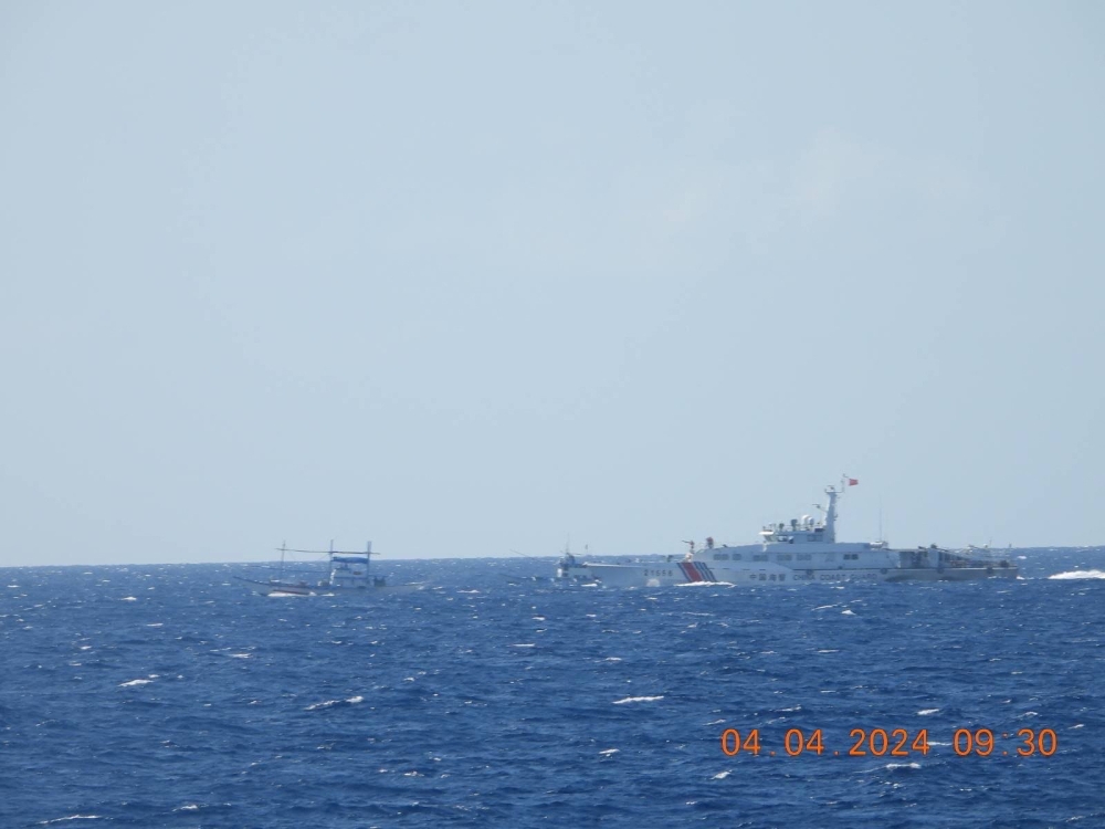 A Chinese coastguard vessel approaches a Filipino fishing vessel in the South China Sea on April 4, 2024, in a handout photo by the Philippine Coast Guard that was released on April 6, 2024. — Philippine Coast Guard handout pic via Reuters 