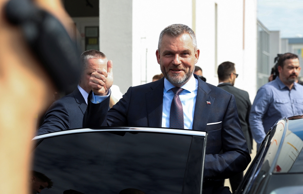 Presidential candidate Peter Pellegrini gestures after casting his vote on the day of country's presidential election run-off, at a polling station in Bratislava, Slovakia, April 6, 2024. — Reuters pic  