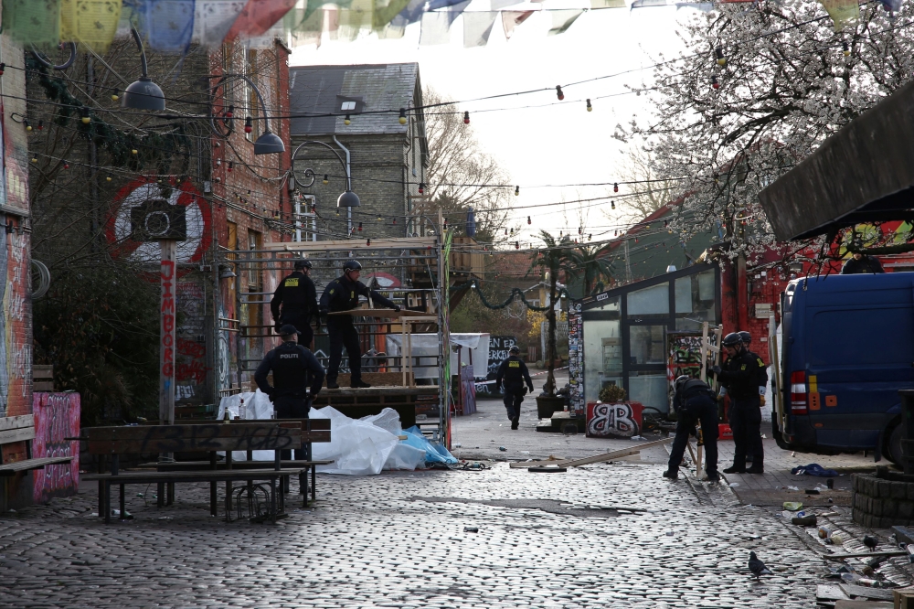 Police clear booths used to sell cannabis from an area known as ‘Pusher Street’ early in the morning in Freetown Christiania in Copenhagen April 6, 2024. — Reuters pic  