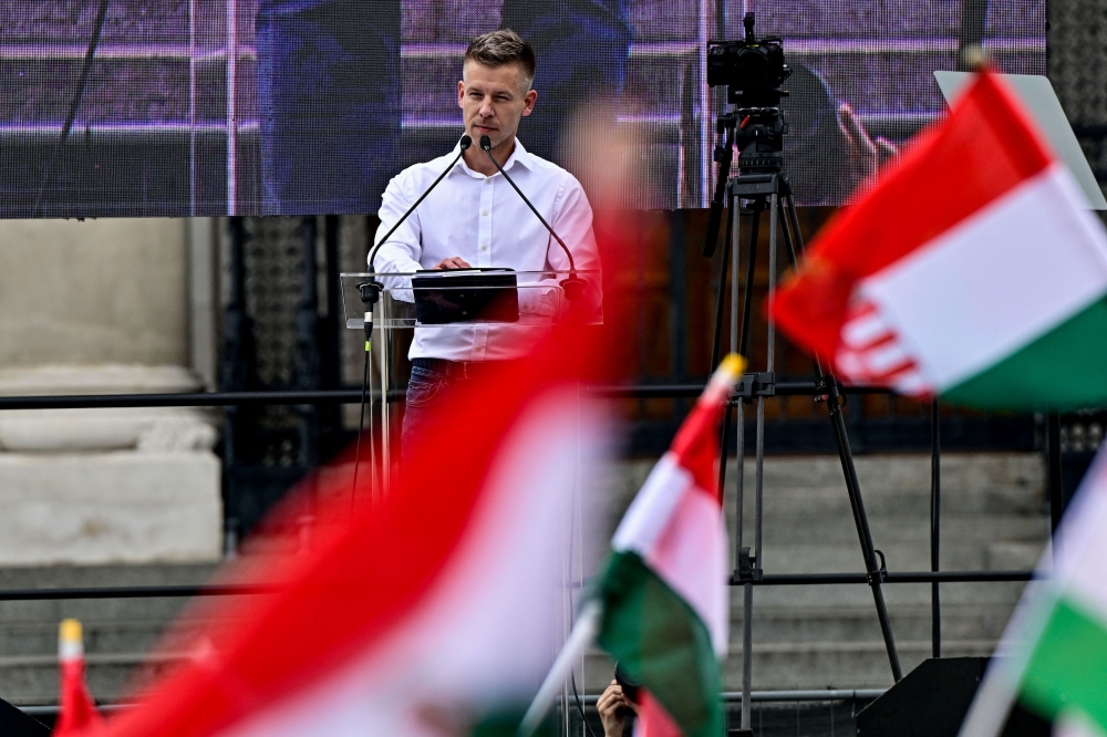 Peter Magyar, a lawyer and businessman formerly close to Hungary's ruling nationalist government, stands on stage during an anti-government protest led by him, in Budapest April 6, 2024. — Reuters pic  