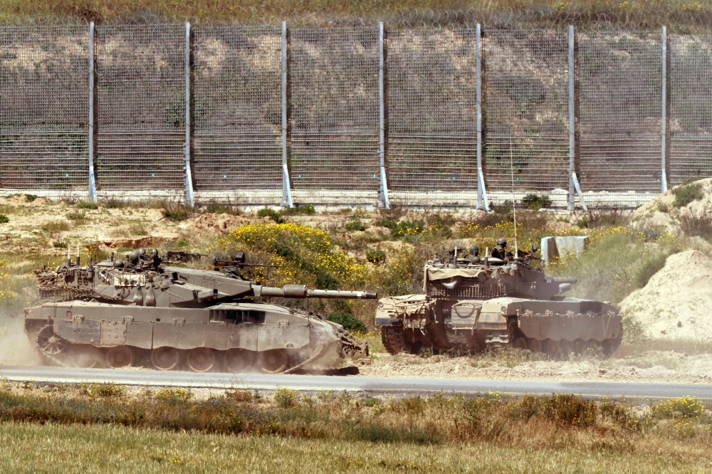 File photo of an Israeli army tank moving in an area along the border with the Gaza Strip and southern Israel on April 4, 2024, amid the ongoing conflict in the Palestinian territory between Israel and Hamas. — AFP pic
