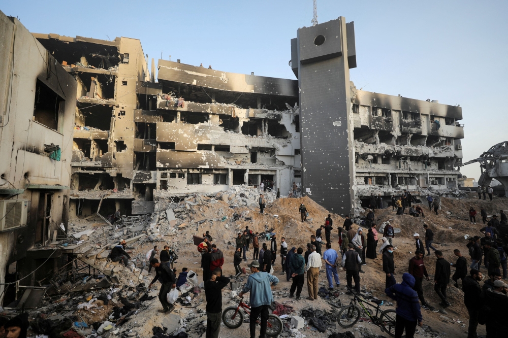 File photo of Palestinians inspecting damages at Al Shifa Hospital after Israeli forces withdrew from the hospital and the area around it following a two-week operation, amid the ongoing conflict between Israel and Hamas, in Gaza City April 1, 2024. — Reuters pic