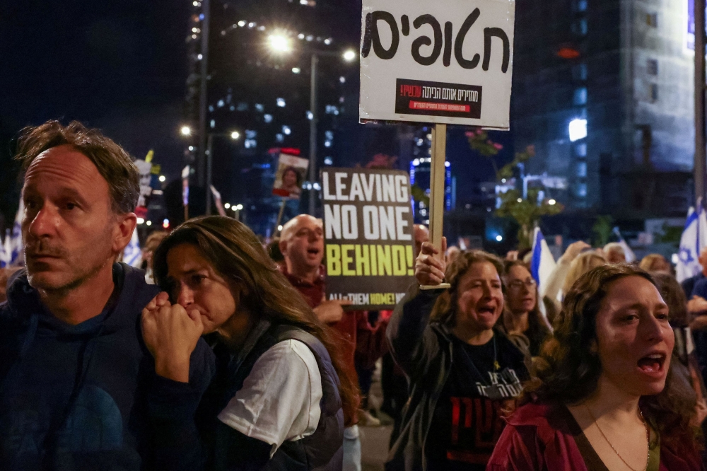 People attend a protest against Israeli Prime Minister Benjamin Netanyahu’s government and to call for the release of hostages kidnapped in the deadly October 7 attack on Israel by Hamas from Gaza, in Tel Aviv, Israel, April 7, 2024. — Reuters pic