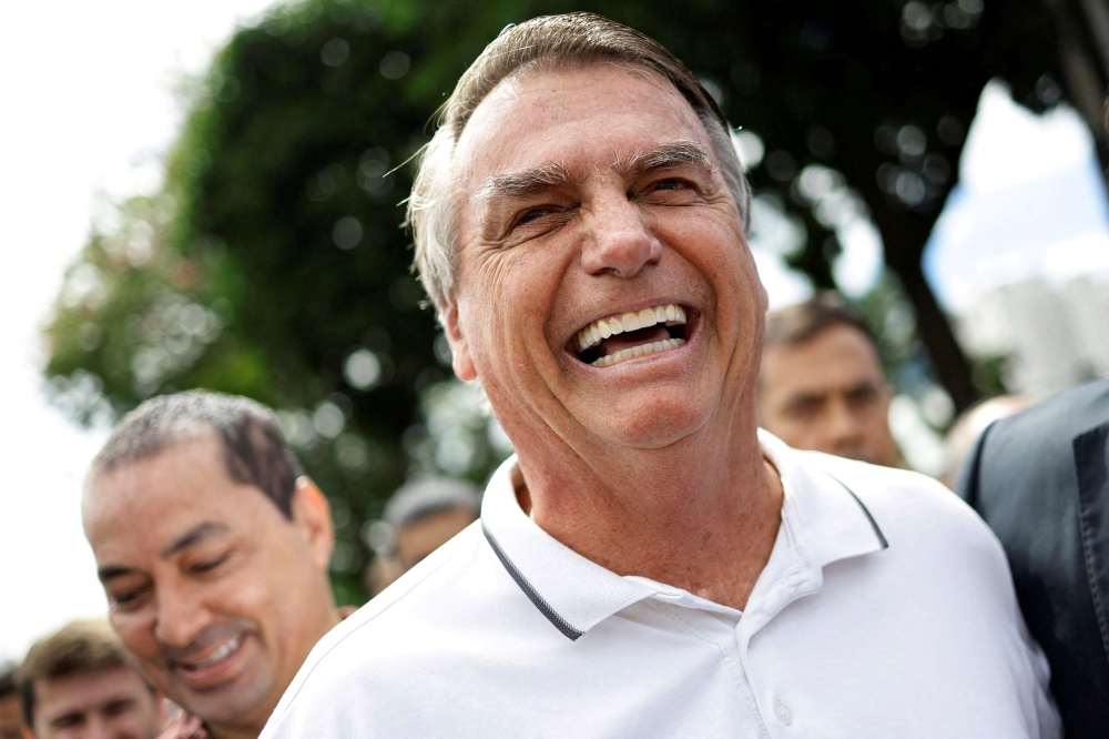 File photo of former Brazilian President Jair Bolsonaro reacting as he arrives for a state meeting of the Liberal Party, in Goiania, Brazil, April 4, 2024. — AFP pic