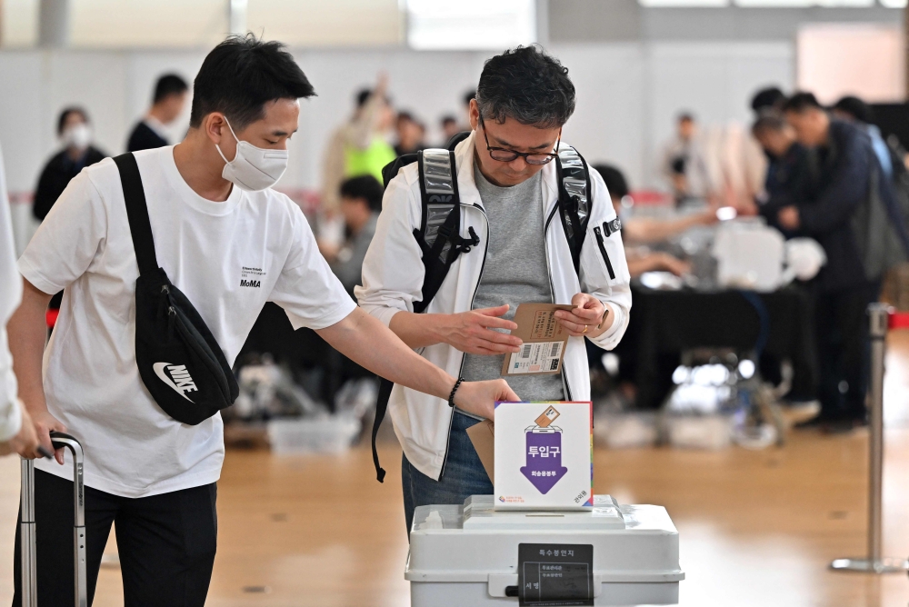 File photo of South Koreans casting their ballots during early voting at a polling station at the departure hall of Incheon International Airport on April 5, 2024, ahead of next week’s parliamentary elections. — AFP pic