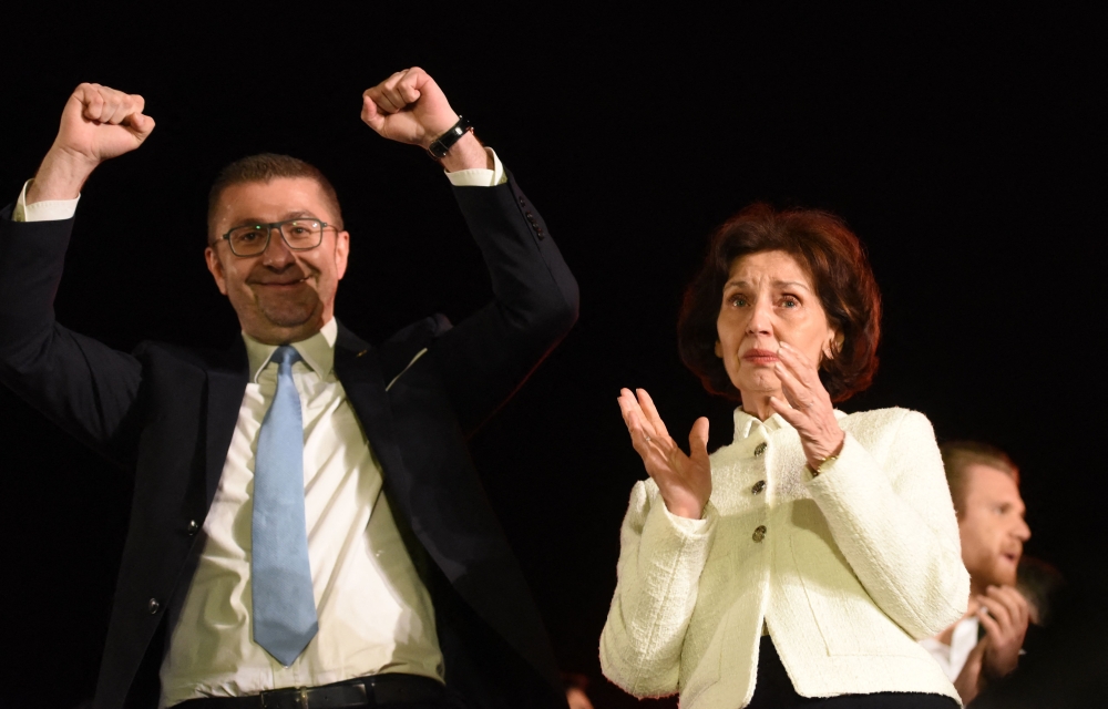 File photo of leader of the largest opposition party VMRO DPMNE Hristijan Mickovski (left) and their Presidential candidate Gordana Siljanovska Davkova (right) greeting supporters at the first-day rally of the presidential campaign in Skopje on April 4, 2024. — AFP pic