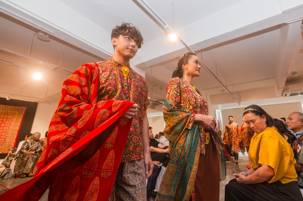 Short-sleeved men’s shirt and fine cotton hand-block print baju kurung with scarves of traditional hand woodblock Ajrak print from Gujarat. — Picture by Raymond Manuel