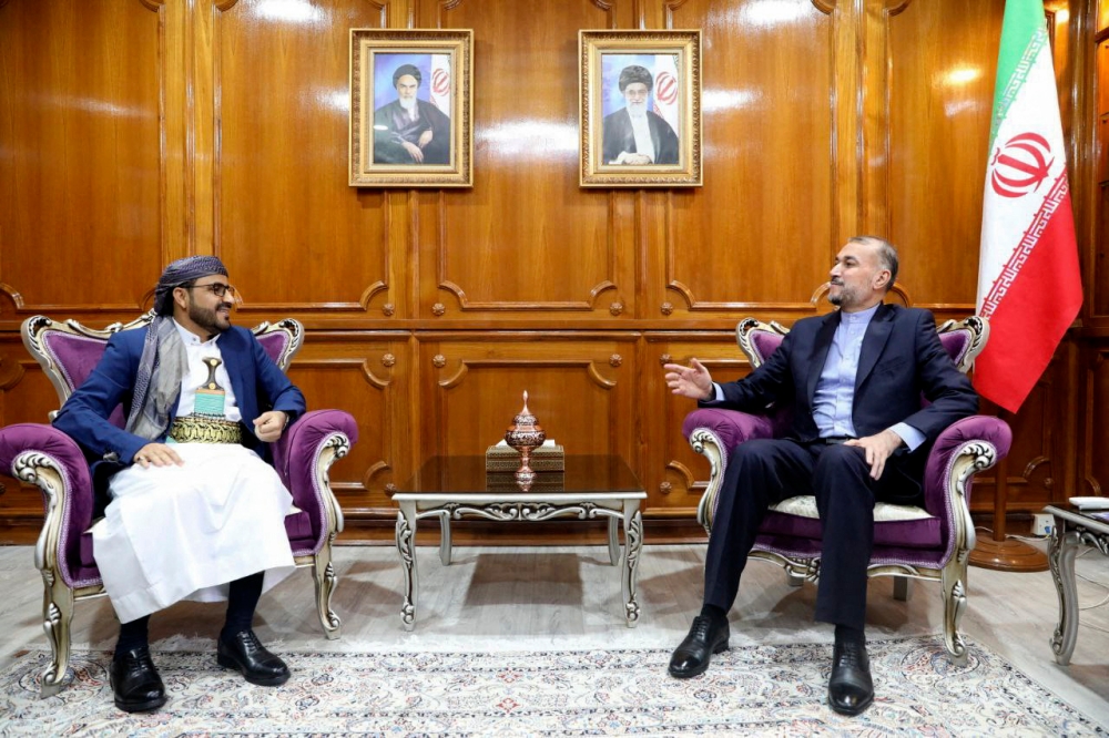 This handout picture provided by the Iranian foreign ministry on April 7, 2024, shows Foreign Minister Hossein Amir Abdollahian (right) meeting with Mohammad Abdul Salam, spokesman for the Yemen's Houthi movement, in Muscat. — Iranian Foreign Ministry / AFP pic