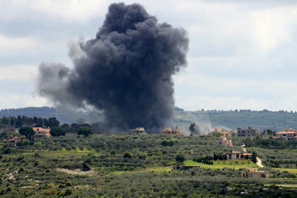 Smoke billows after an Israeli strike on the southern Lebanese border village of Tayr Harfa on April 6, 2024. — AFP pic