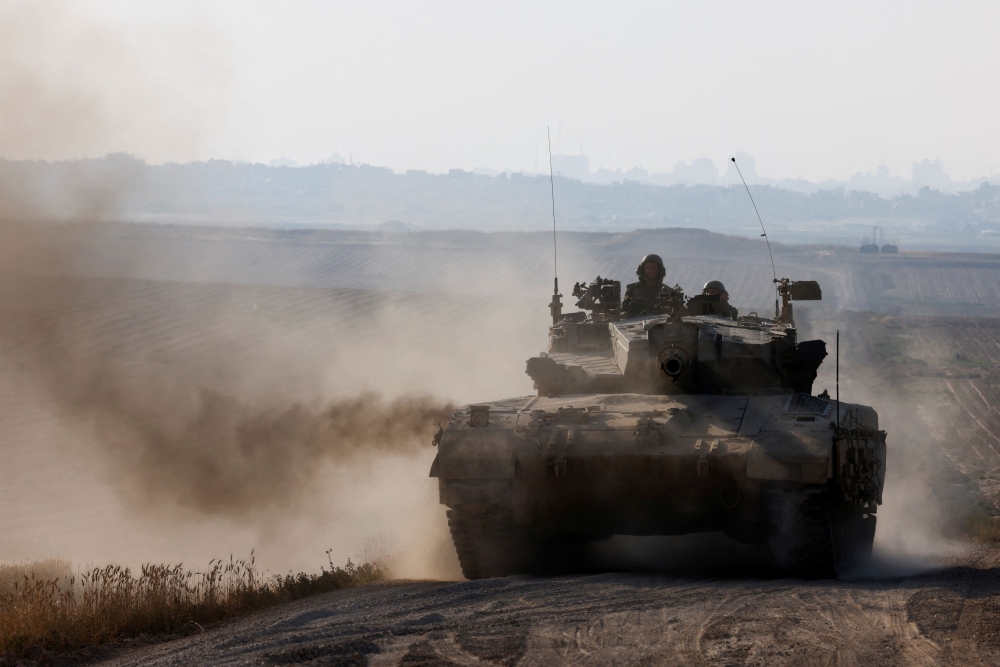 Israeli tank maneuvers near Israel's border with Gaza, amid the ongoing conflict between Israel and the Palestinian Islamist group Hamas, in southern Israel, April 7, 2024. — Reuters pic
