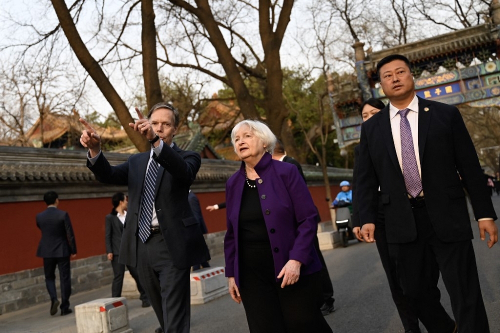 US Treasury Secretary Janet Yellen (centre) and US Ambassador to China Nicholas Burns (left) visit Guozijian Hutong alley in Beijing on April 8, 2024. — AFP pic