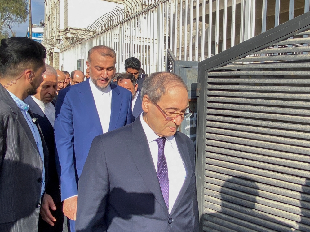 Syrian Foreign Minister Faisal Mekdad and Iran’s Foreign Minister Hossein Amirabdollahian enter the new Iranian consulate building after the former Iran’s consulate in Damascus was targeted in a suspected Israeli attack on April 1, in Damascus, Syria April 8, 2024. — Reuters pic