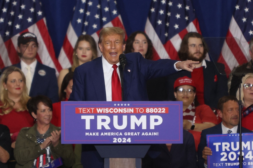 Former US President and 2024 presidential hopeful Donald Trump speaks during a campaign rally at the Hyatt Regency in Green Bay, Wisconsin April 2, 2024. — AFP pic