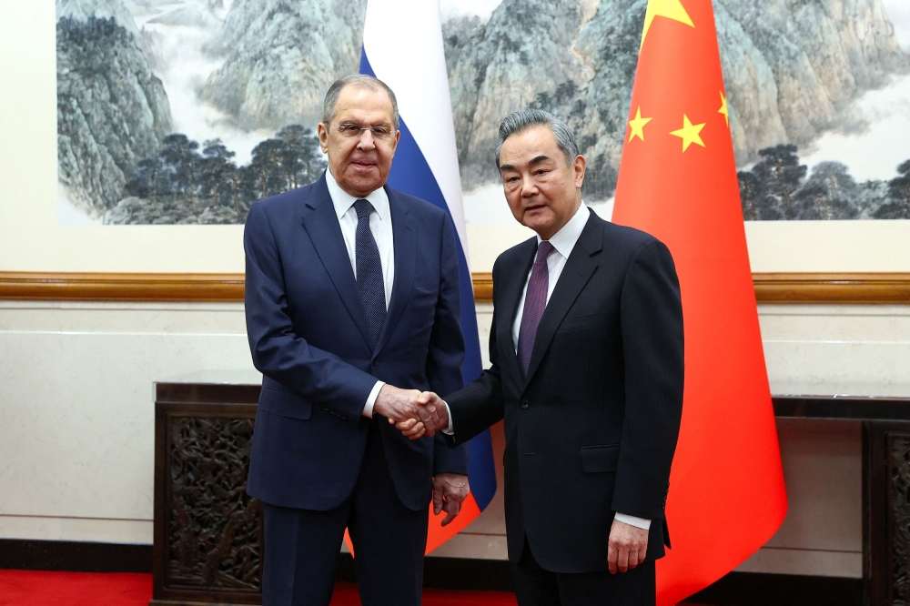 Russia's Foreign Minister Sergei Lavrov shakes hands with China's Foreign Minister Wang Yi during a meeting in Beijing, China April 9, 2024. — Picture by Russian Foreign Ministry/Handout via Reuters
