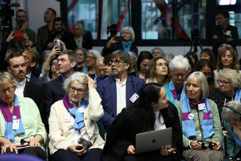 Former French ecologist mayor of Grande-Synthe, Damien Careme (centre) and representatives and lawyers of three climate change cases involving France, Portugal and Switzerland attend a hearing of the European Court of Human Rights (ECHR) to decide in three separate cases if states are doing enough in the face of global warming in rulings that could force them to do more, in Strasbourg, eastern France, on April 9, 2024. — AFP pic