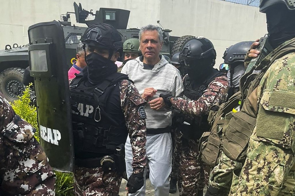 This handout picture released by the Ecuadorian Police shows former Ecuadorian vice president Jorge Glas being escorted by members of the Special Penitentiary Action Group (GEAP) during his arrival at the maximum security prison La Roca in Guayaquil on April 6, 2024. Ecuadorian authorities stormed the Mexican embassy in Quito on April 5 to arrest former vice president Jorge Glas, who had been granted political asylum there, prompting Mexico to sever diplomatic ties after the ‘violation of international law’. — Handout / Ecuadorian Police / AFP pic