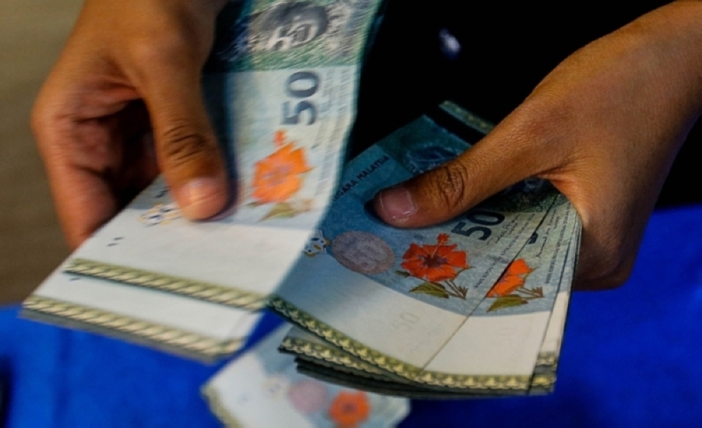 Ringgit closes higher against US dollar ahead of US CPI data | Malay Mail